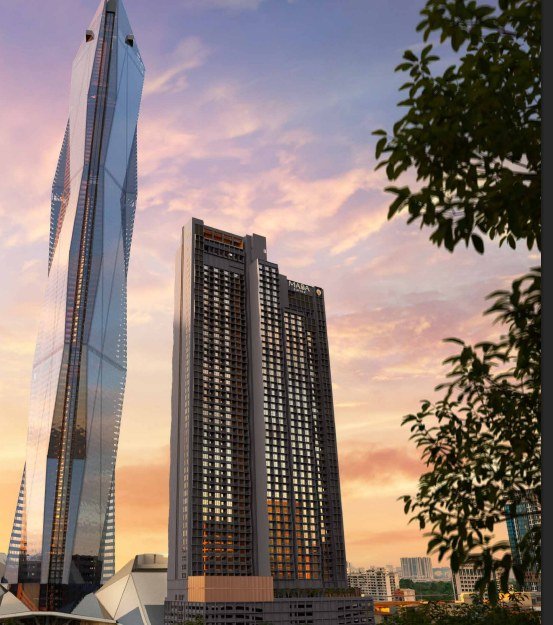 Maba Suitez facade — twin towers opposite Merdeka 118